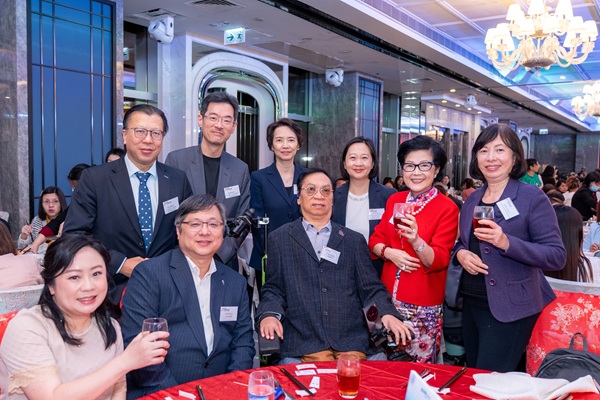 Mrs. Pang poses for a photo with guests. Mrs. Pang poses for a photo with guests.